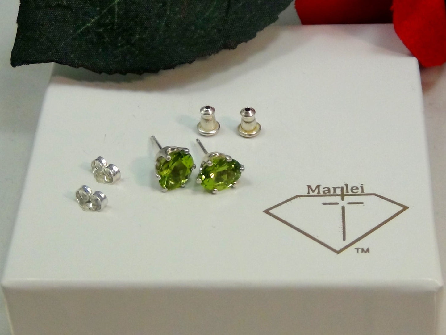 Vivid Green Peridot Earrings. Striking! 8mm x 6mm Oval Shape. Sterling Silver. Backs, case, and gift box provided.