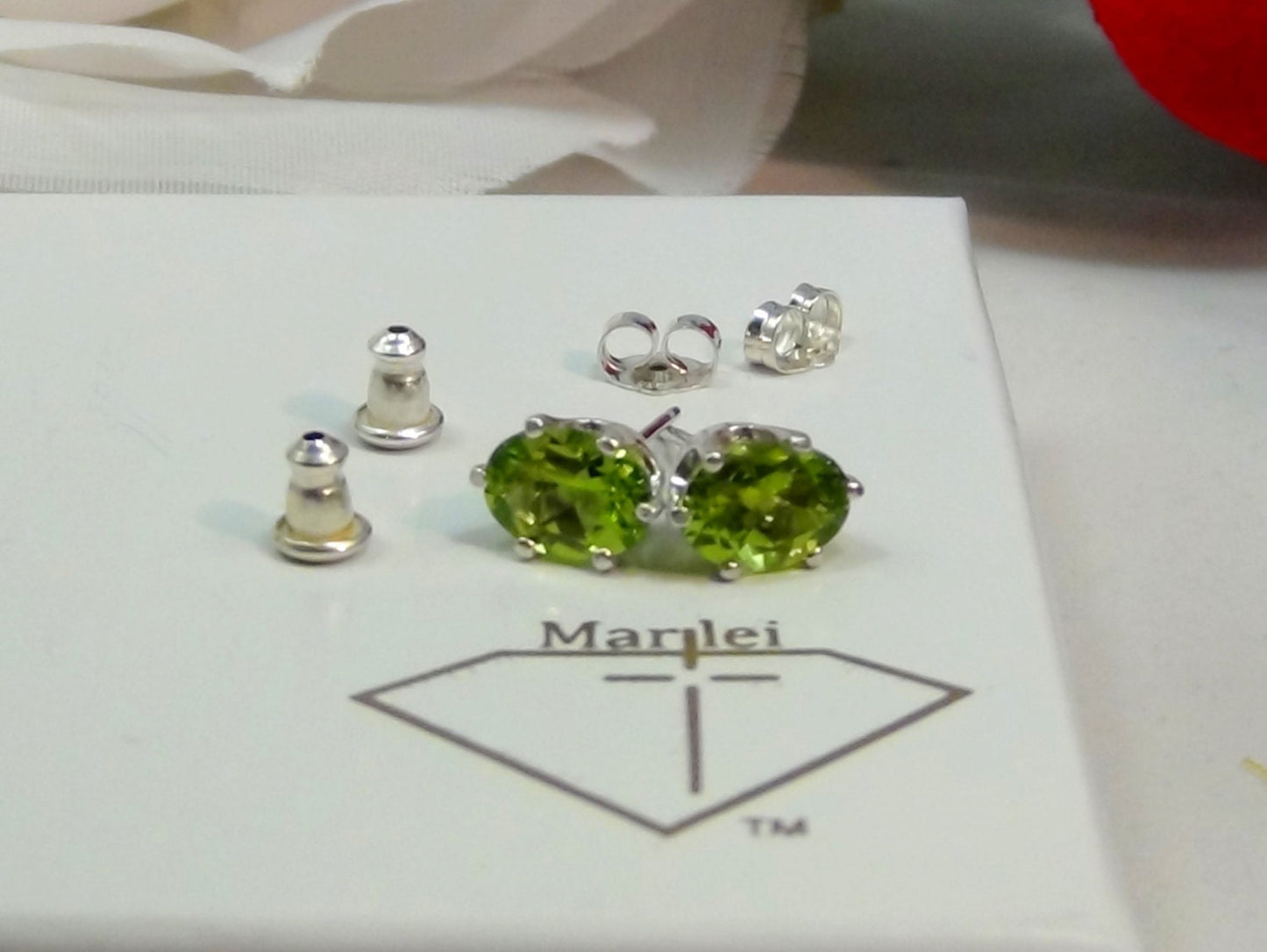 Vivid Green Peridot Earrings. Striking! 8mm x 6mm Oval Shape. Sterling Silver. Backs, case, and gift box provided.