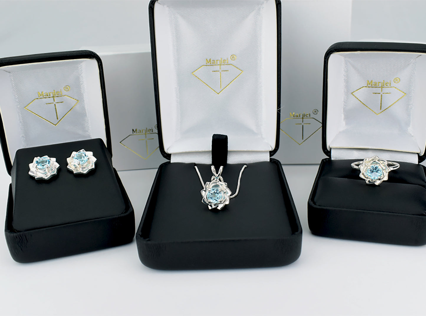 Light blue lotus flower collection.  Matching Sky Blue Topaz Jewelry.