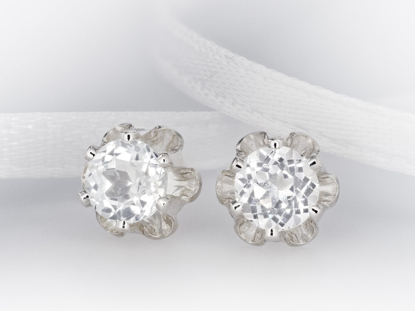 Natural 4mm Sparkling White Topaz earrings. Authentic Brazilian gemstones in a Clover design. Round faceted. Sterling Silver.