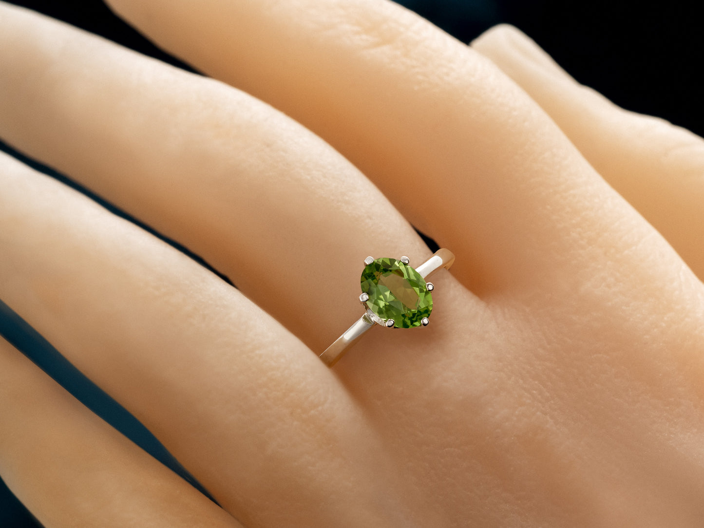 Sparkling green peridot ring. 8x6mm oval faceted natural peridot gemstone in sterling silver.