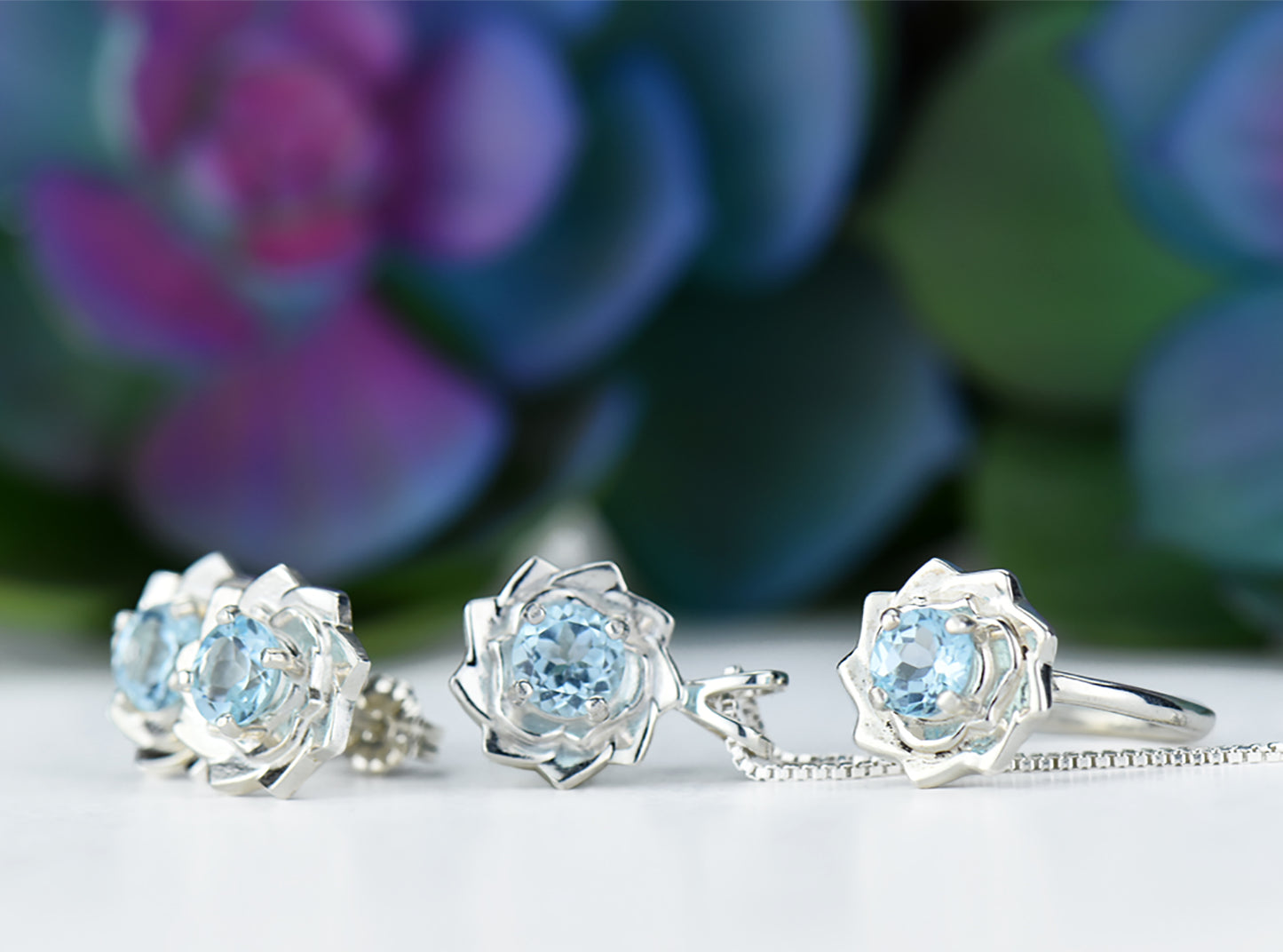 Light blue lotus flower collection.  Matching Sky Blue Topaz Jewelry.