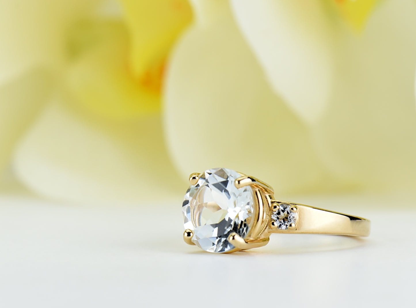 Perfection! Authentic White Topaz Ring from Brazil. 14kt or 10kt Yellow Gold Ring featuring a 10mm Centerstone and 3mm white topaz accents.