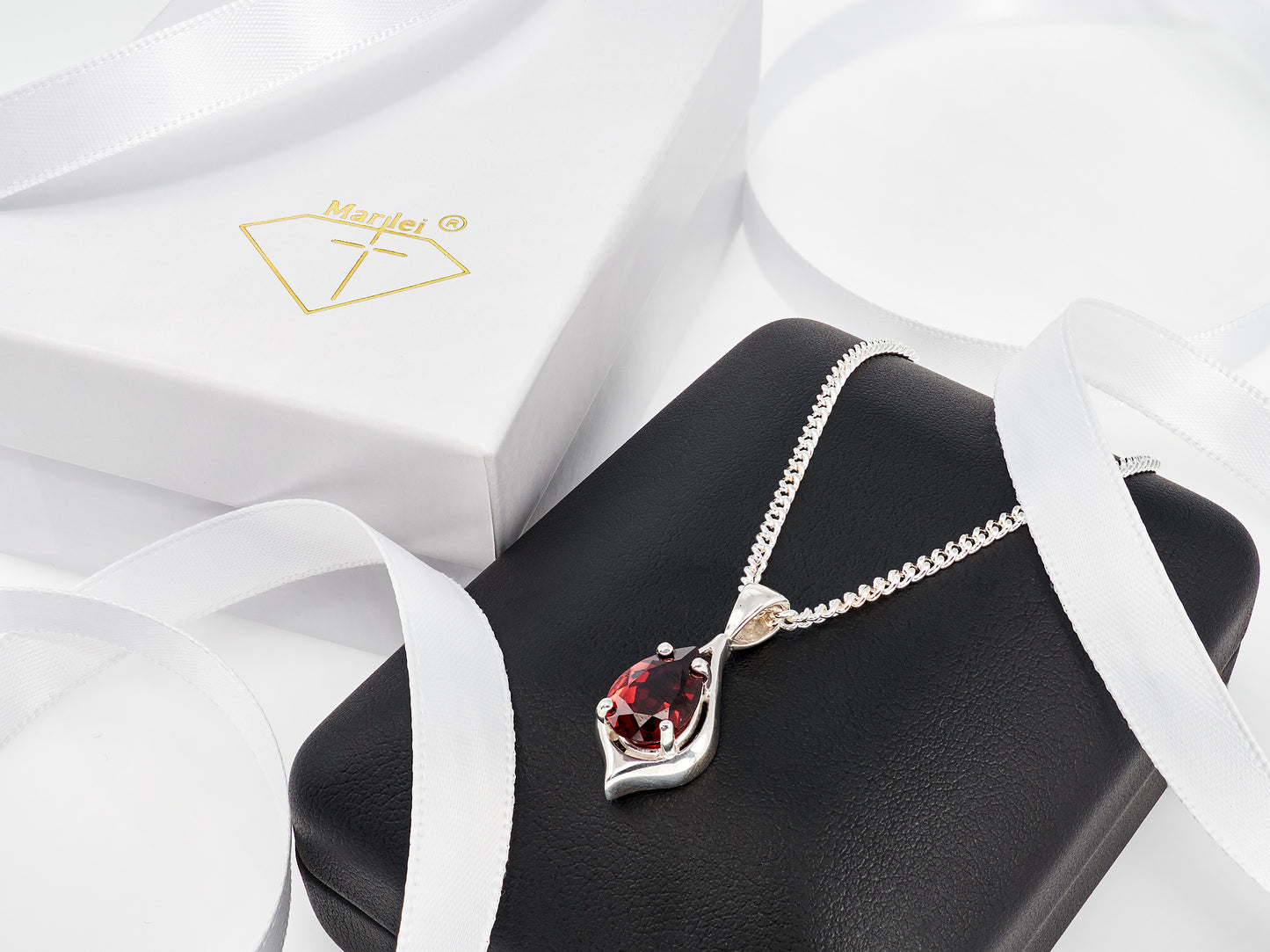 Handmade, striking red, garnet pendant necklace from Brazil. Pear, 10x7mm, 4-Prong, sterling silver pendant.