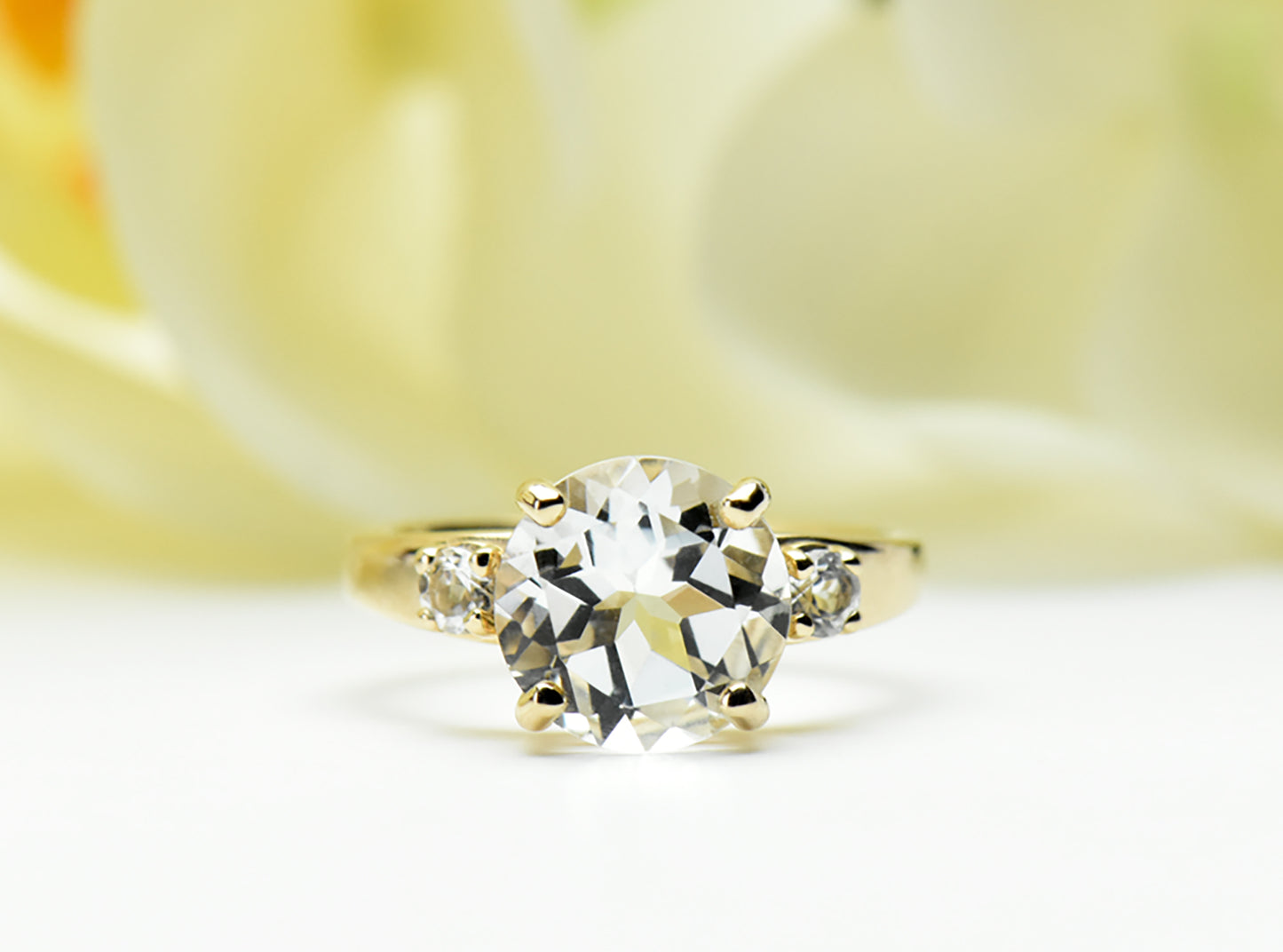 Perfection! Authentic White Topaz Ring from Brazil. 14kt or 10kt Yellow Gold Ring featuring a 10mm Centerstone and 3mm white topaz accents.