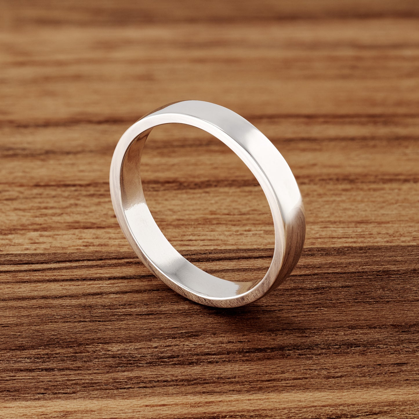 Premium Sterling Silver Band.  Great as a wedding band substitute when traveling.  4mm wide, polished DeOx sterling silver.